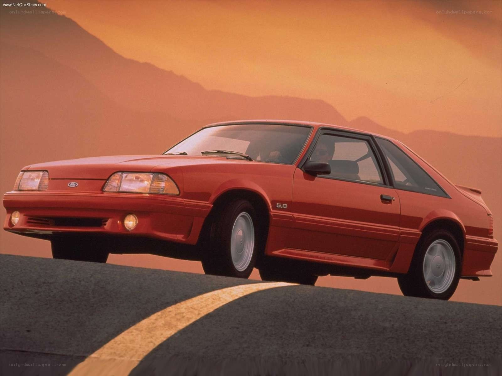 Red Ford Mustang on a road