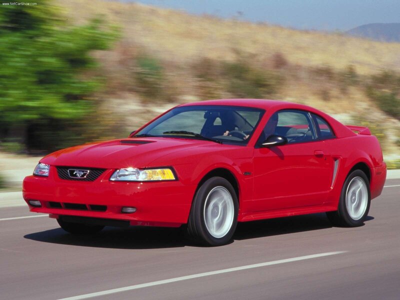Red Ford Mustang on a road