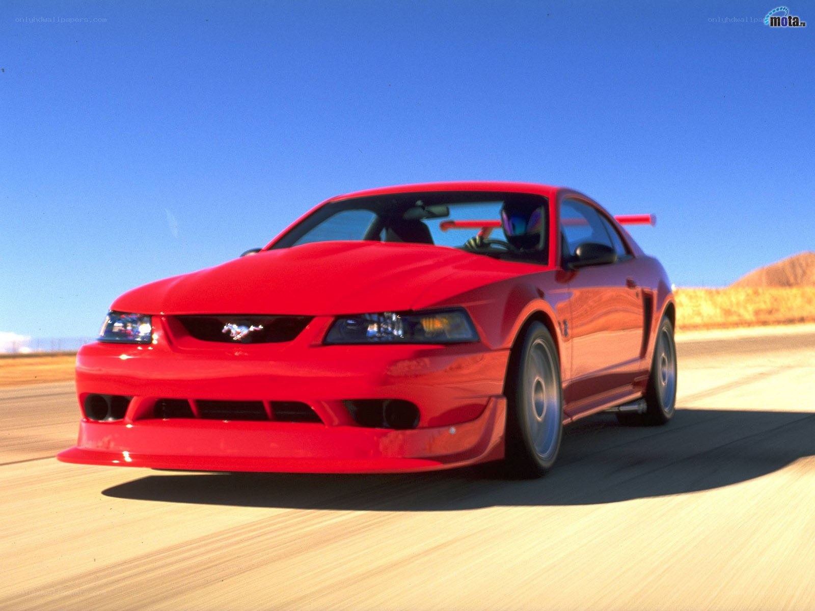 Red Ford Mustang on a track