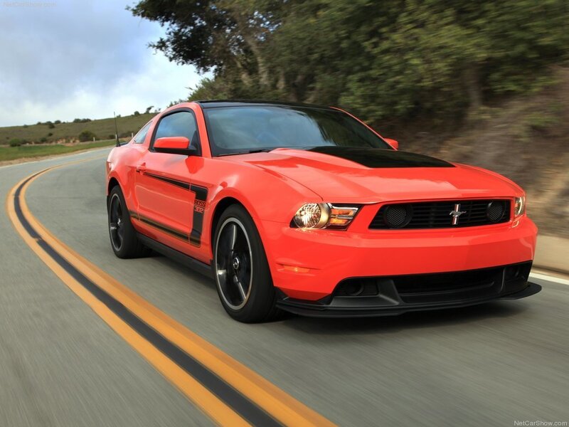 Red Ford Mustang on a winding road