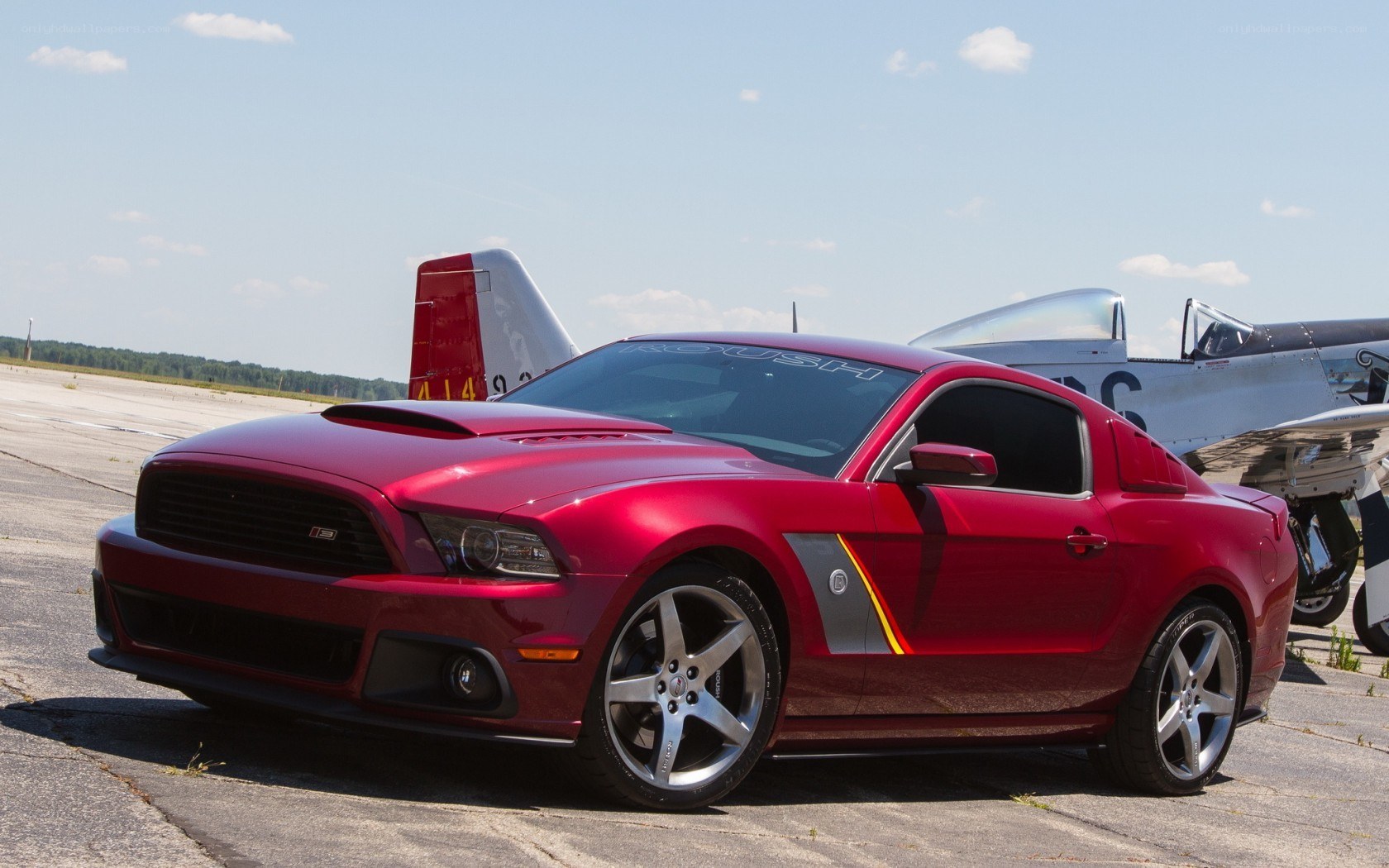 Red Ford Mustang on airfield