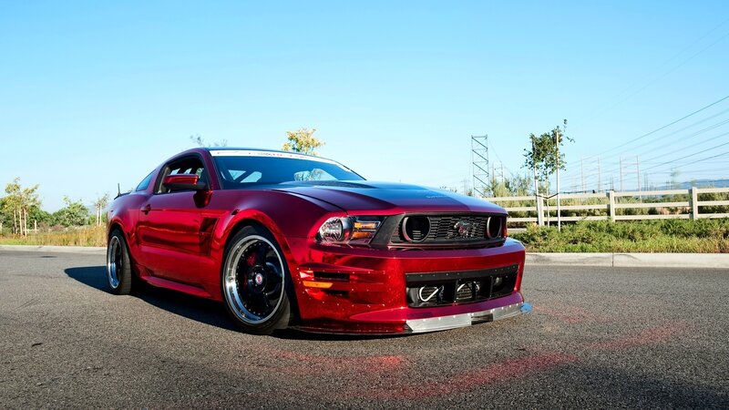 Red Ford Mustang on asphalt