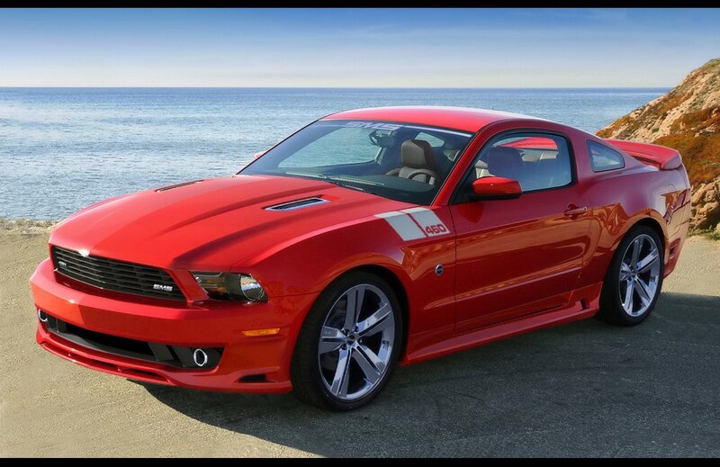 Red Ford Mustang on coastal road