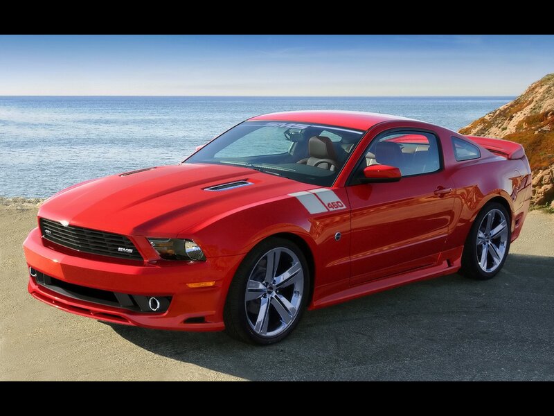 Red Ford Mustang on coastal road