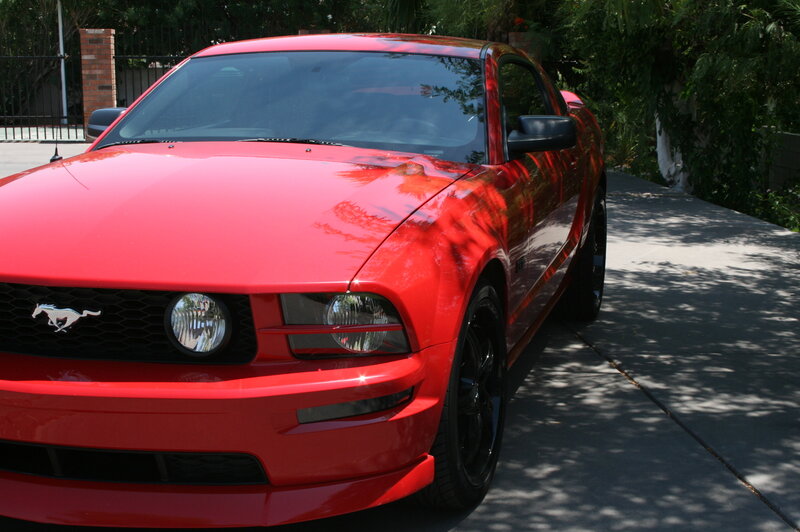 Red Ford Mustang on driveway