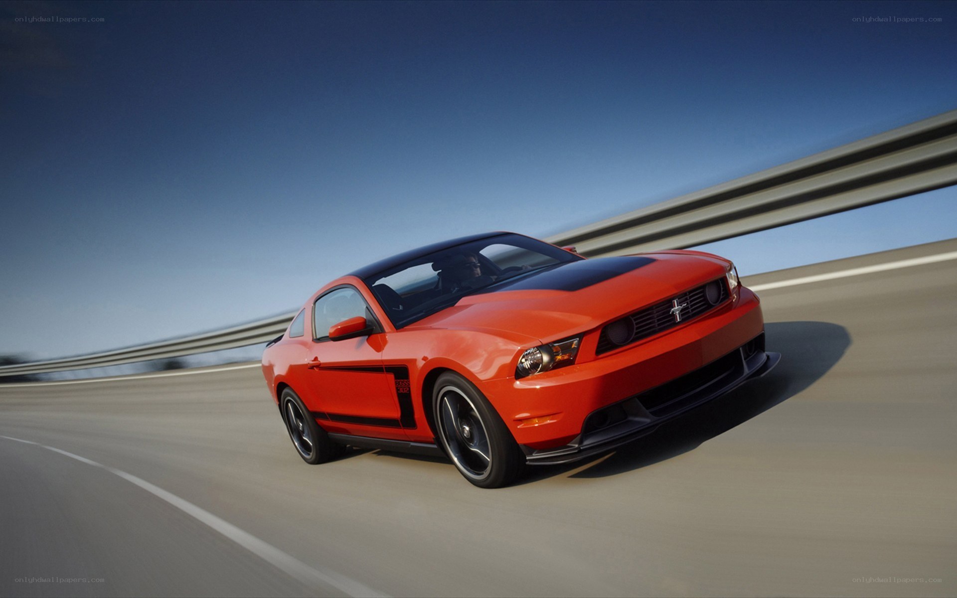 Red Ford Mustang on highway