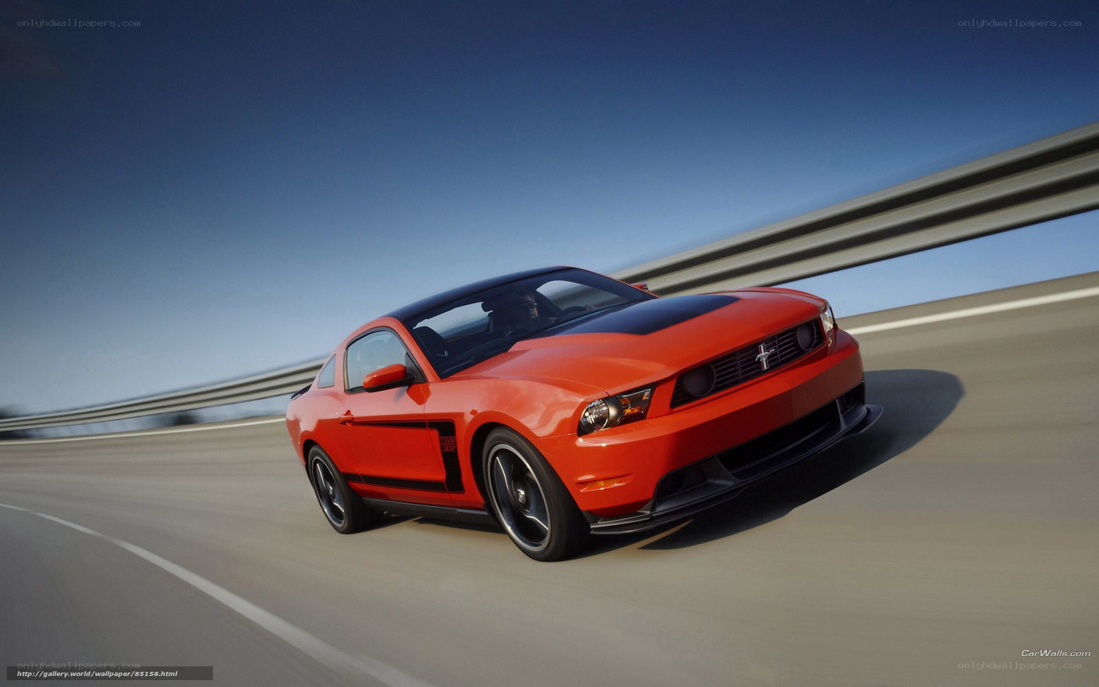 Red Ford Mustang on highway