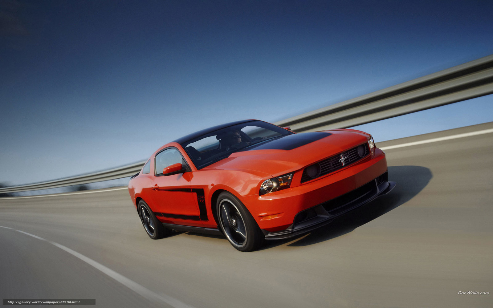 Red Ford Mustang on highway
