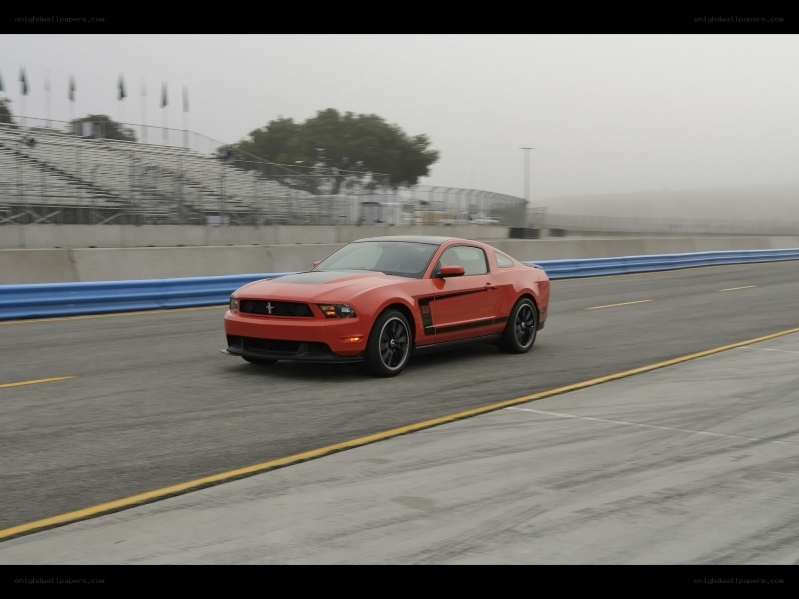 Red Ford Mustang on racetrack
