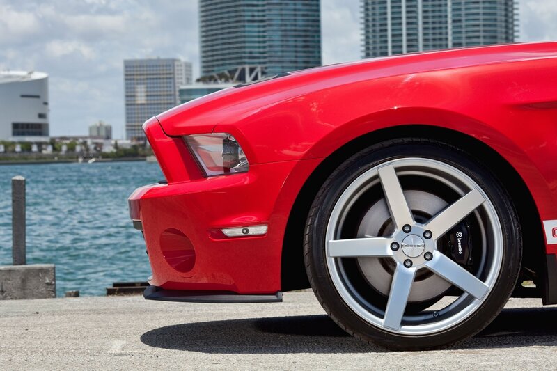 Red Ford Mustang on waterfront