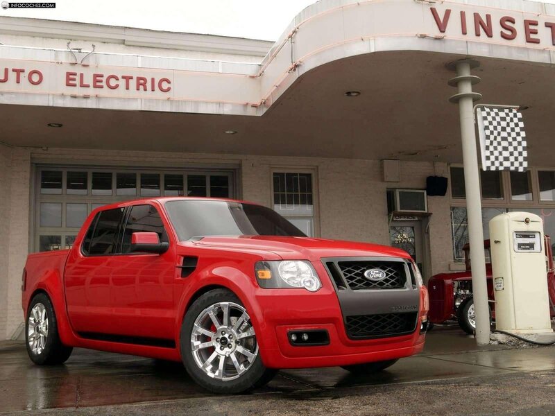 Red Ford pickup at vintage gas station