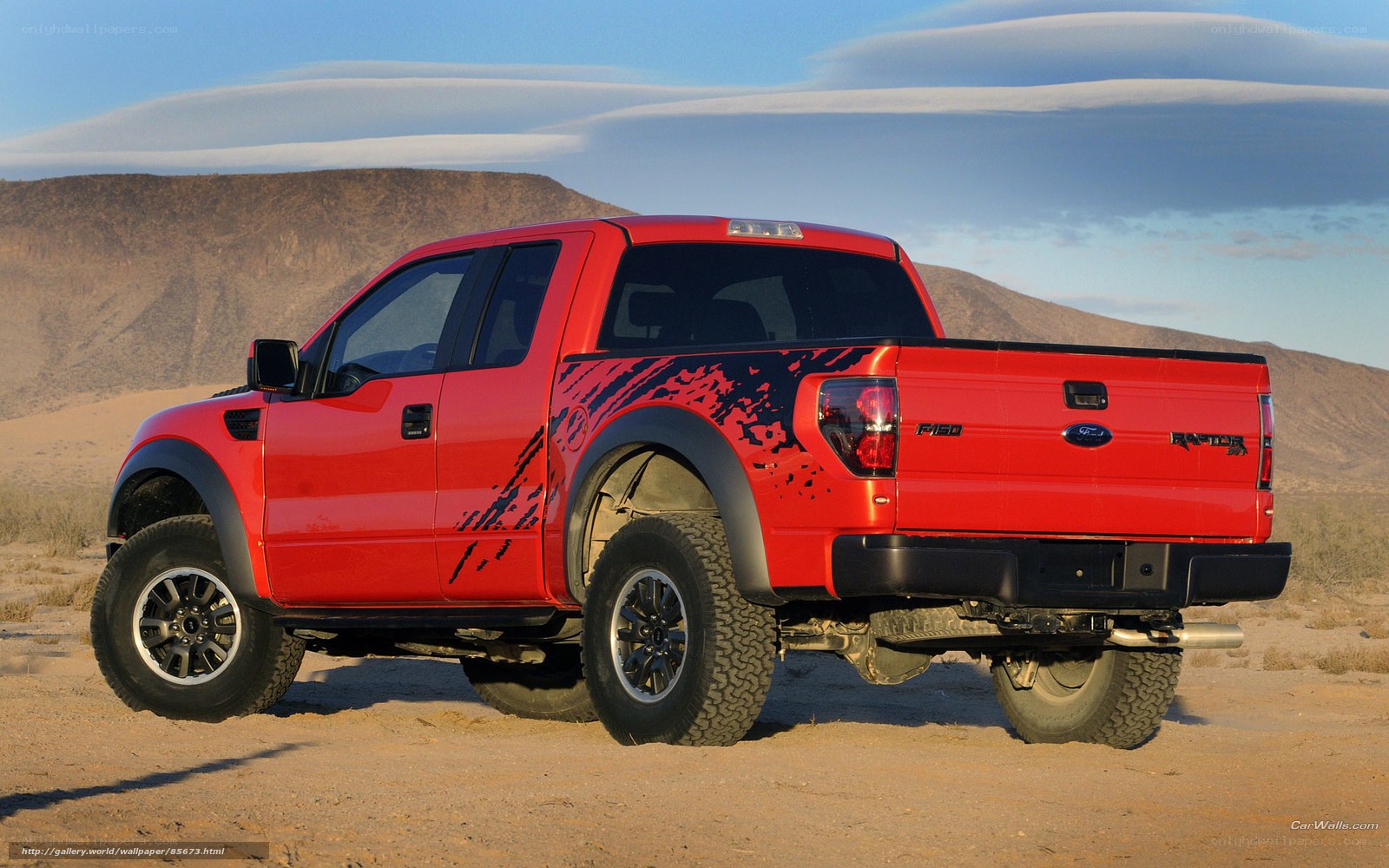 Red Ford Raptor in desert