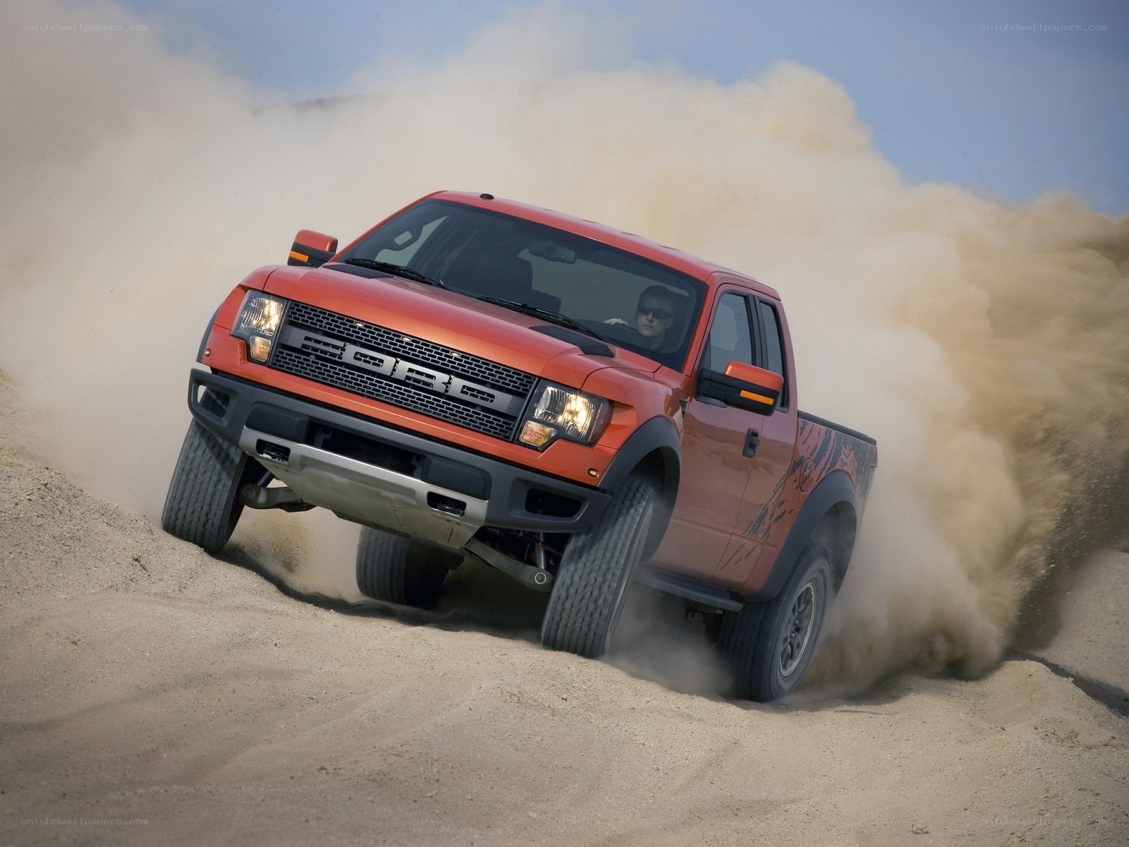 Red Ford Raptor off-roading