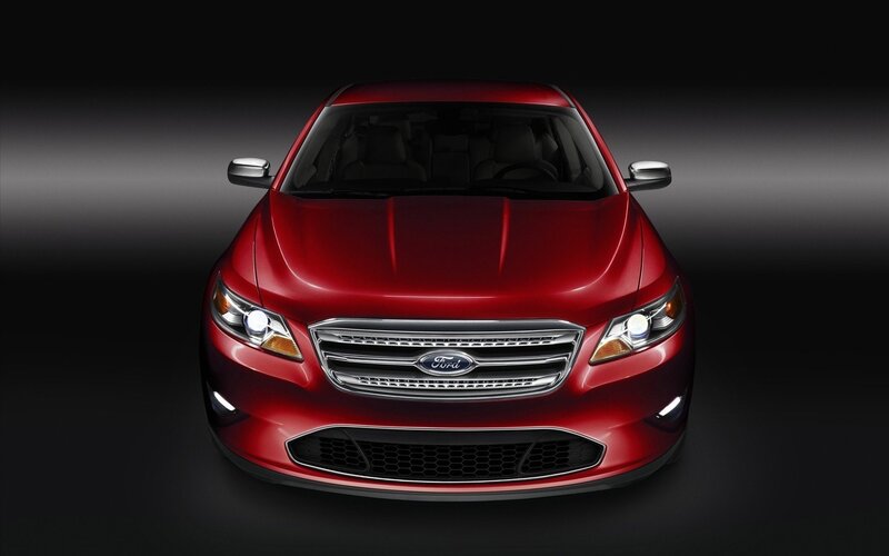 Red Ford Taurus front view