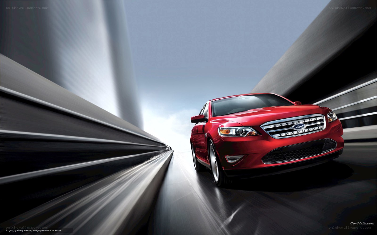 Red Ford Taurus in motion