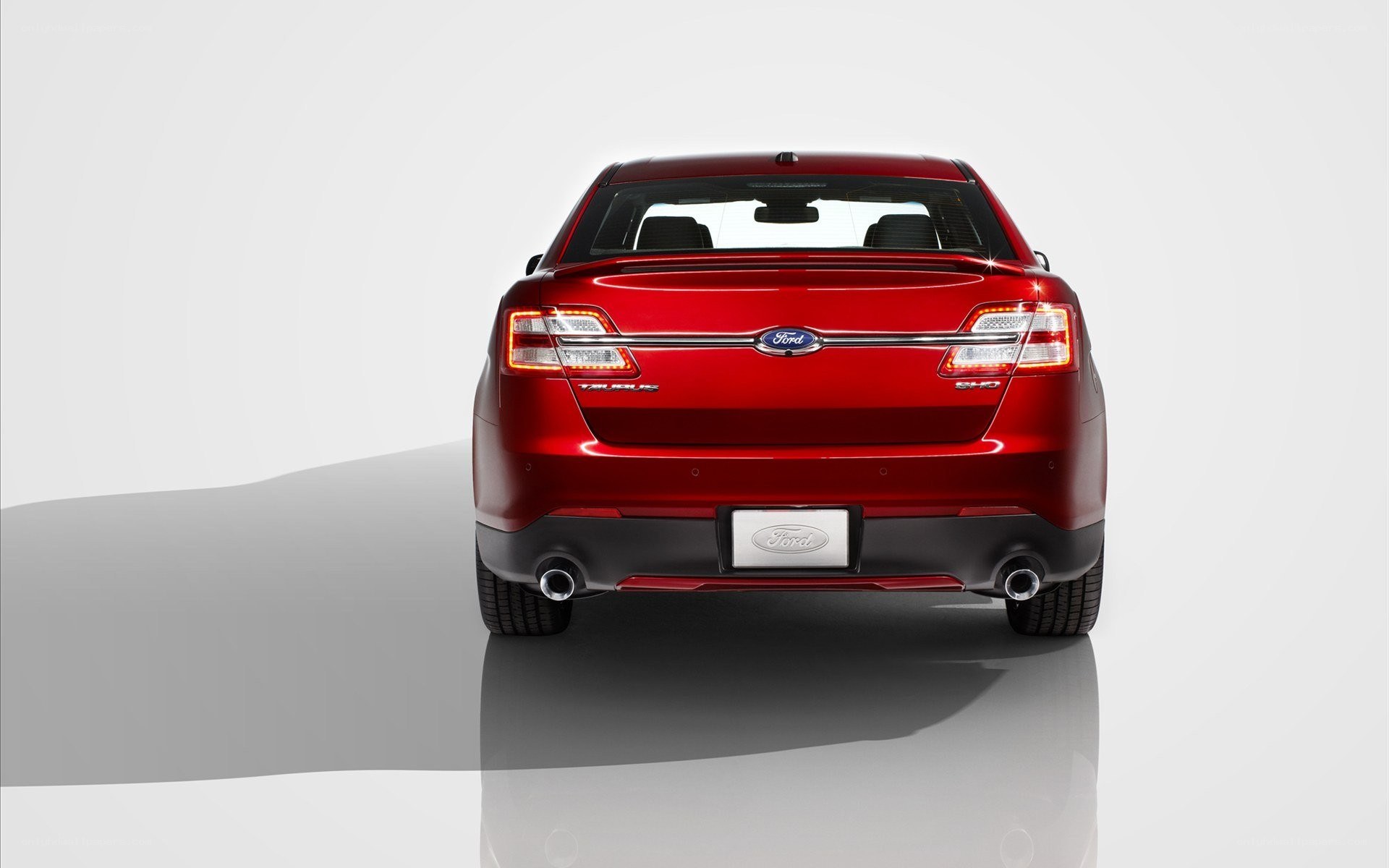 Red Ford Taurus SHO rear view