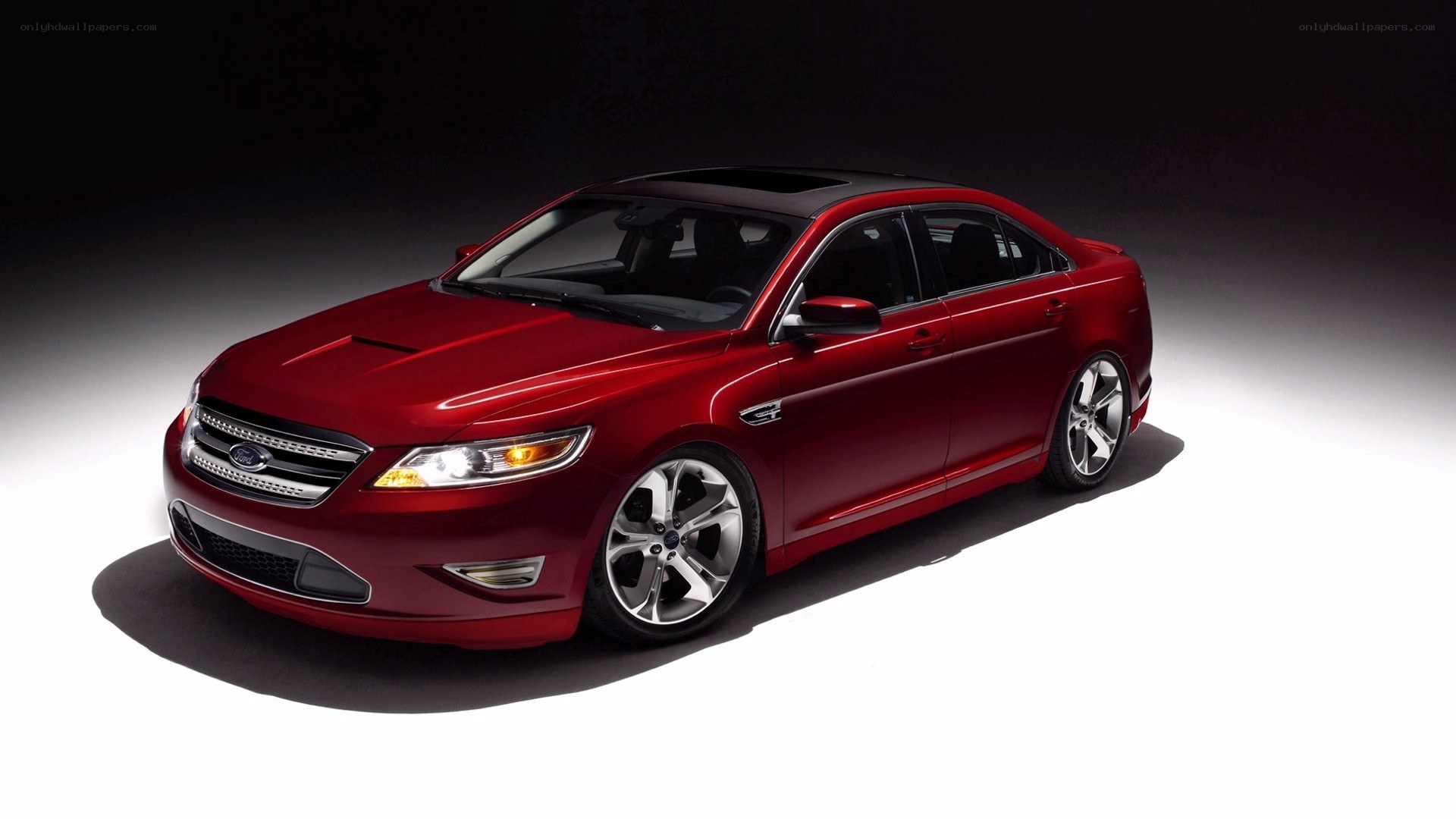 Red Ford Taurus SHO sedan