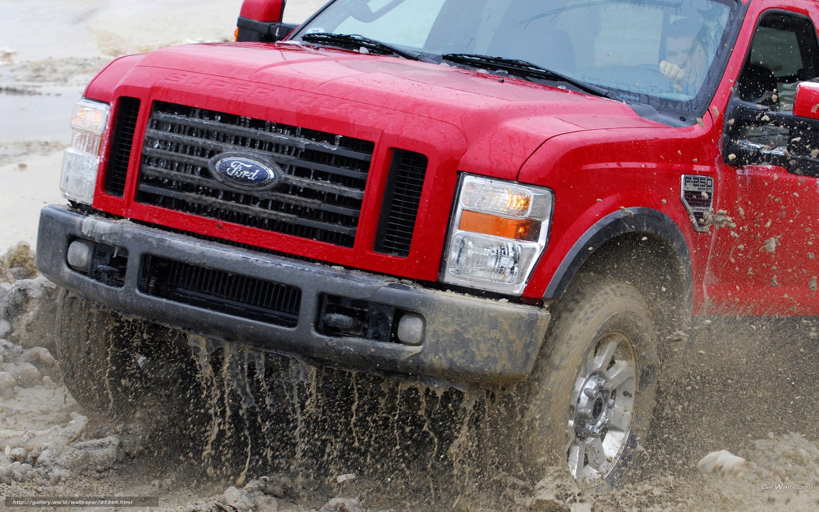 red ford truck in mud