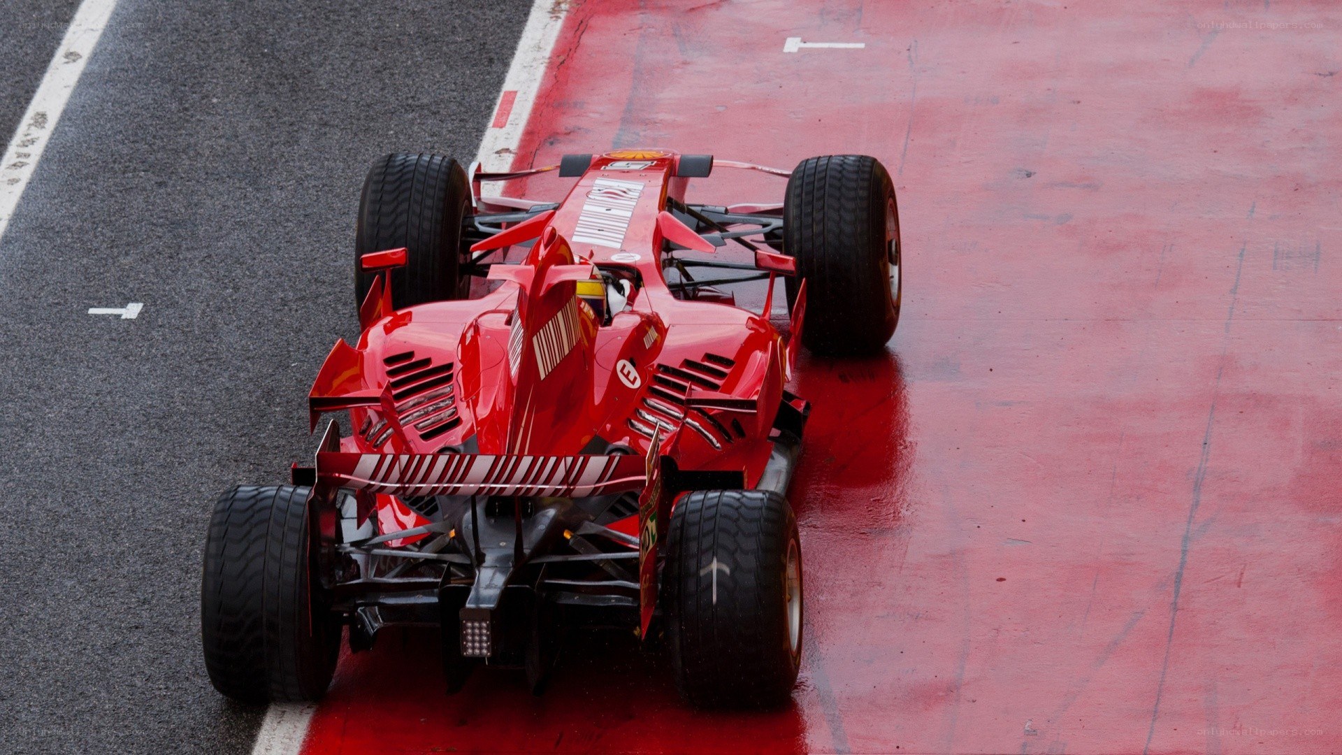 Red Formula 1 car on track