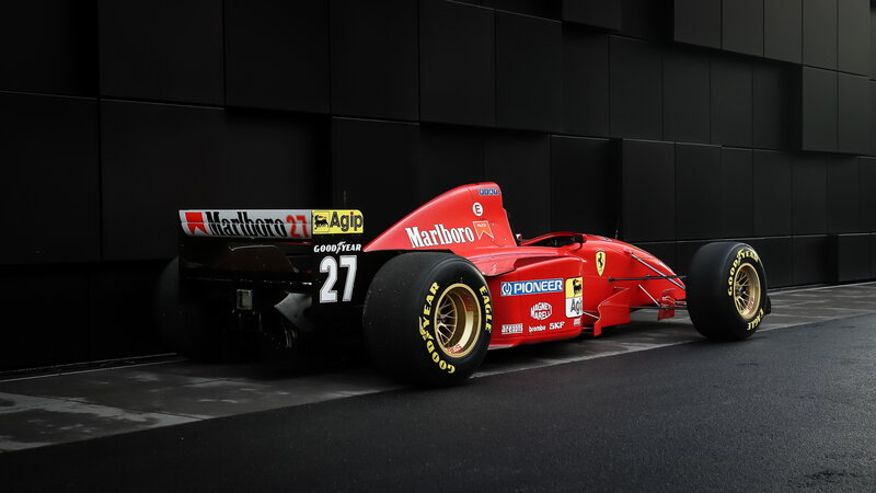 Red Formula One Car — Dramatic, Photograph, Tires, Wall