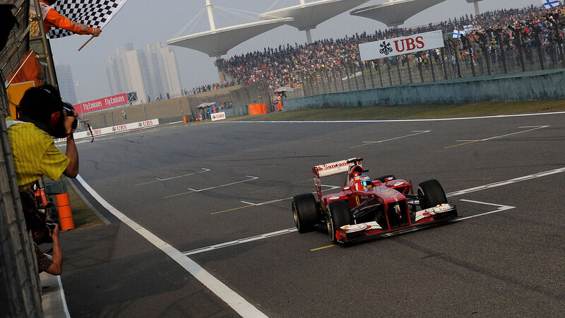 Red Formula One Car — Dynamic, Afternoon, Photograph, Crowd, Checkered Flag