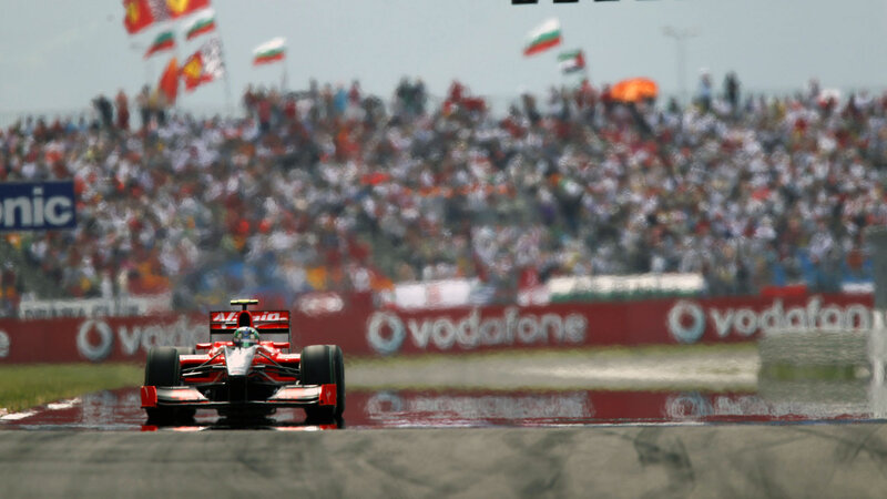 Red Formula One Car — Dynamic, Afternoon, Photograph, Crowd, Flags
