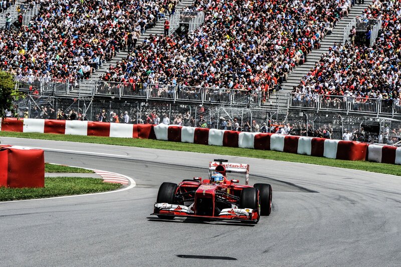 Red Formula One Car — Dynamic, Afternoon, Photograph, Crowd, Racetrack, Grandstand, Gray