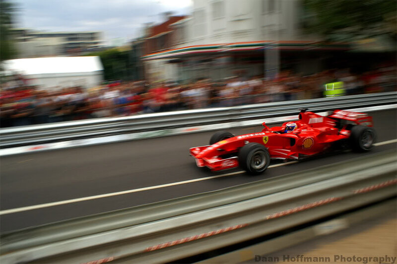 Red Formula One Car — Dynamic, Afternoon, Photograph, Crowd, Track