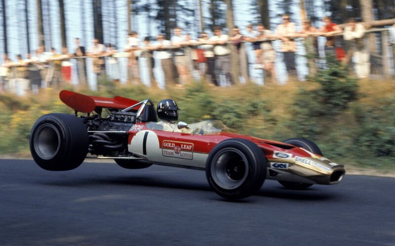 Red Formula One Car — Dynamic, Afternoon, Photograph, Driver, Crowd, Trees