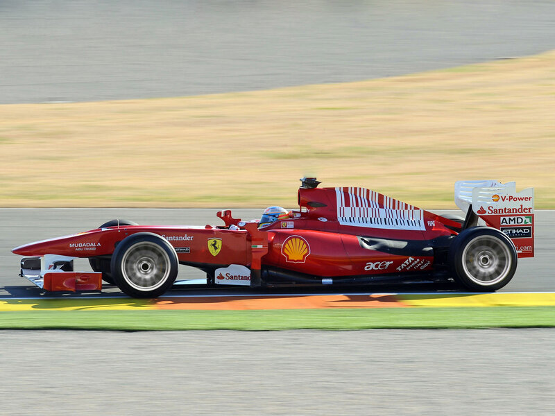 Red Formula One Car — Dynamic, Afternoon, Photograph, Driver, Race Track, Sponsors