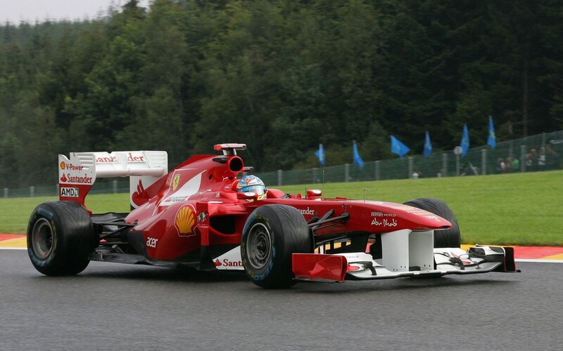 Red Formula One Car — Dynamic, Afternoon, Photograph, Driver, Race Track, Trees, Flags