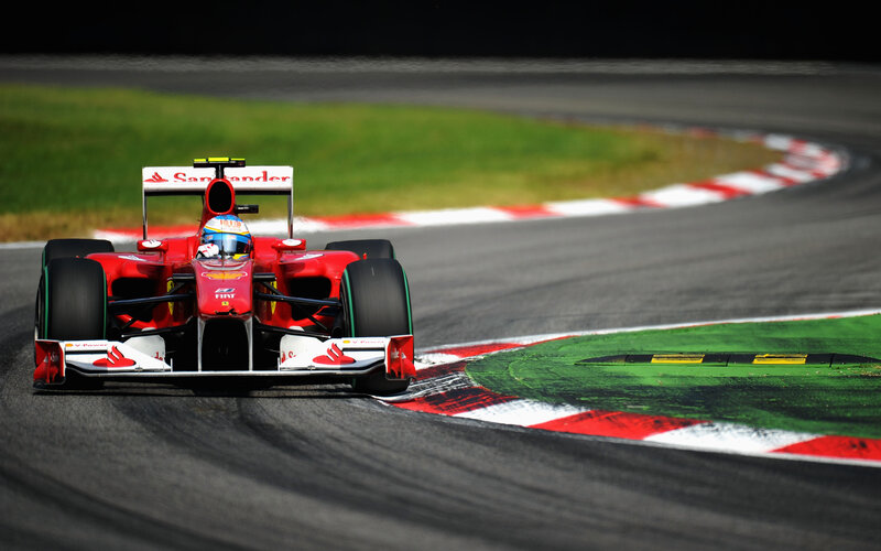 Red Formula One Car — Dynamic, Afternoon, Photograph, Driver, Racetrack, Grass