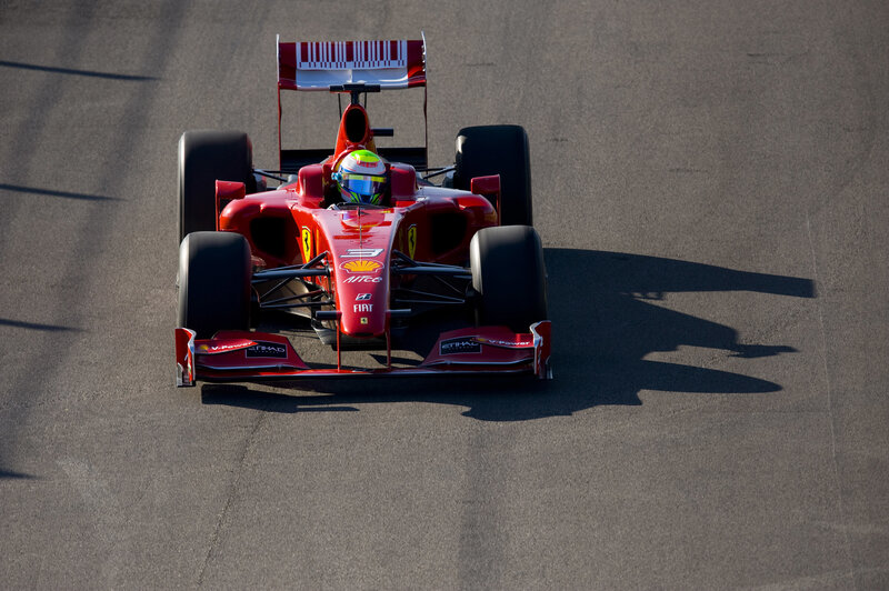 Red Formula One Car — Dynamic, Afternoon, Photograph, Driver, Racing Track, Shadow