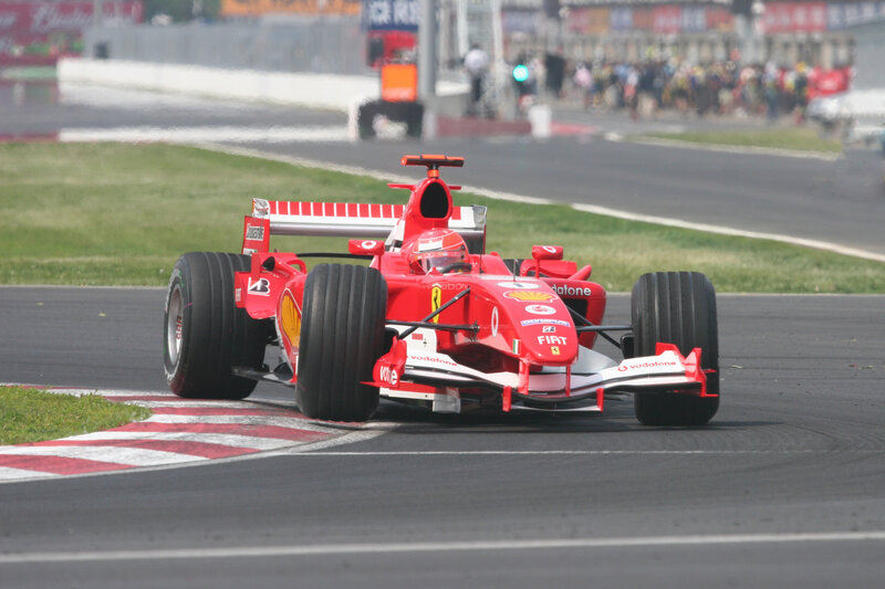 Red Formula One Car — Dynamic, Afternoon, Photograph, Driver, Track