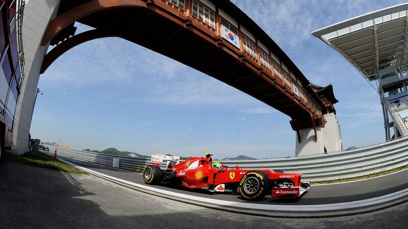 Red Formula One Car — Dynamic, Afternoon, Photograph, Race Track, Bridge