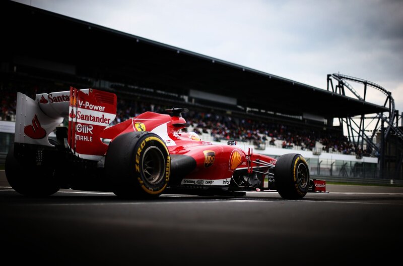 Red Formula One Car — Dynamic, Afternoon, Photograph, Race Track, Grandstand, Crowd