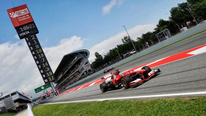 Red Formula One Car — Dynamic, Afternoon, Photograph, Race Track, Grandstand, Scoreboard