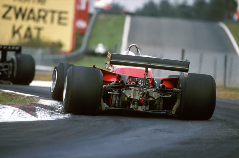 Red Formula One Car — Dynamic, Afternoon, Photograph, Race Track