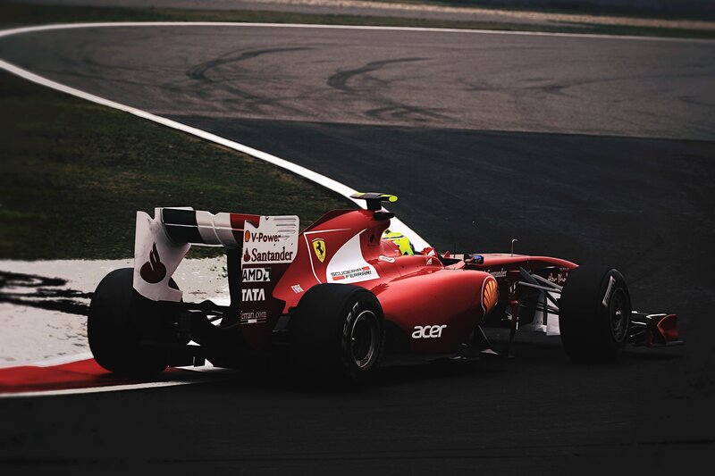 Red Formula One Car — Dynamic, Photograph, Driver, Track, Tire Marks