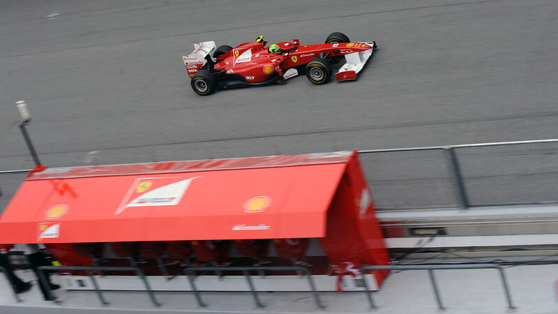 Red Formula One Car — Dynamic, Photograph, Race Track, Pit Lane