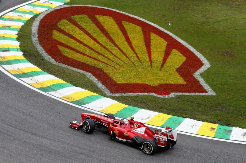 Red Formula One Car — Dynamic, Photograph, Race Track, Shell Logo