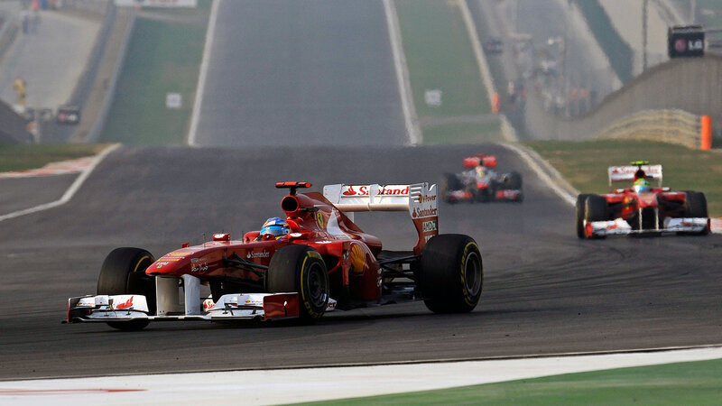 Red Formula One Car — Dynamic, Photograph, Racing Track, Other Cars