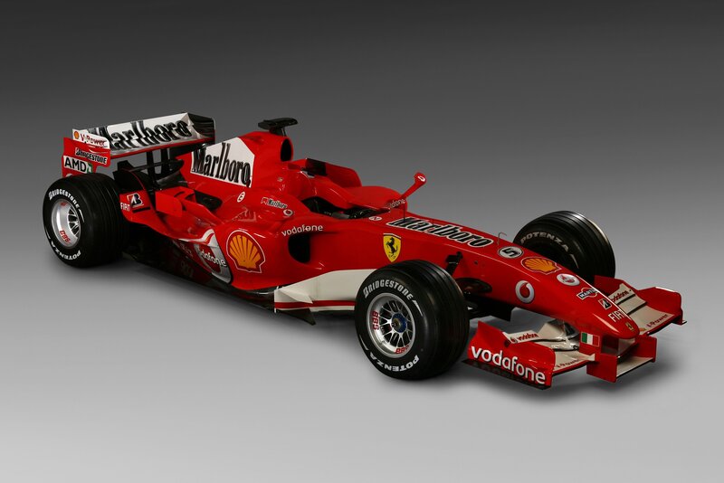 Red Formula One Car — Neutral, Photograph, Sponsor Logos, Racing Tires