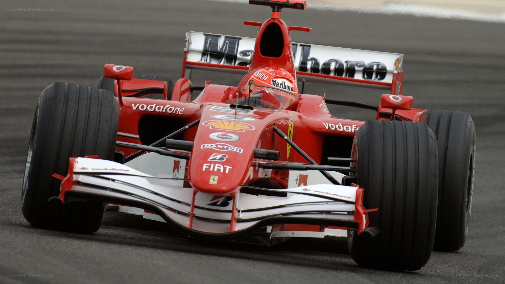 red formula one car on track