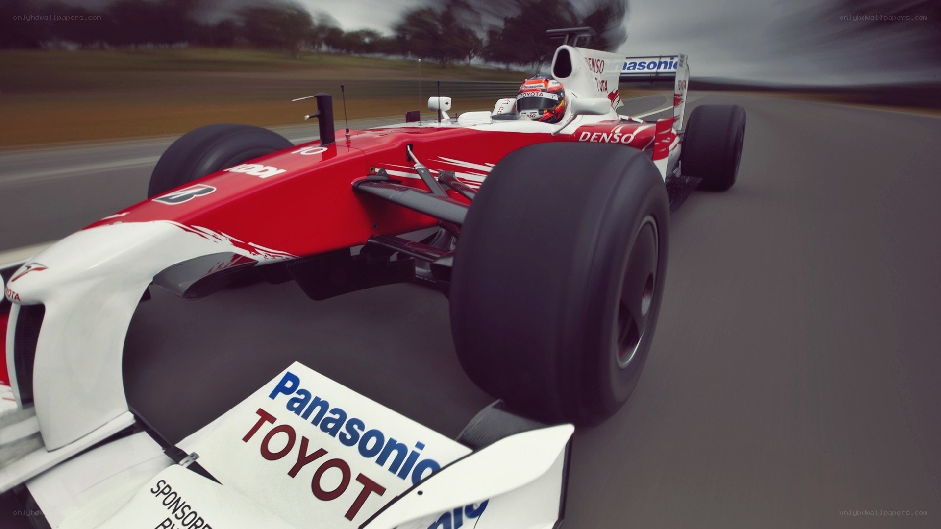 red formula one car on track