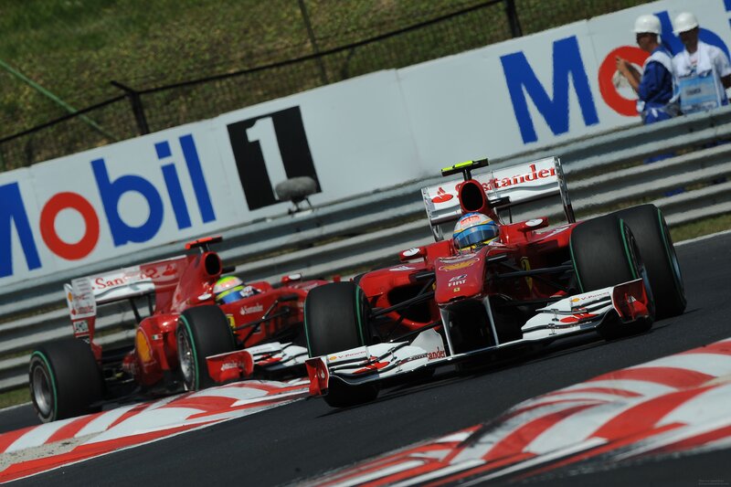 Red Formula One Cars — Dynamic, Afternoon, Photograph, Racetrack, Drivers