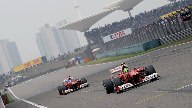 Red Formula One Cars — Dynamic, Afternoon, Photograph