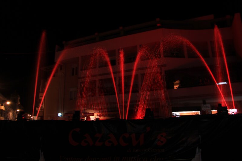 Red fountain display at night