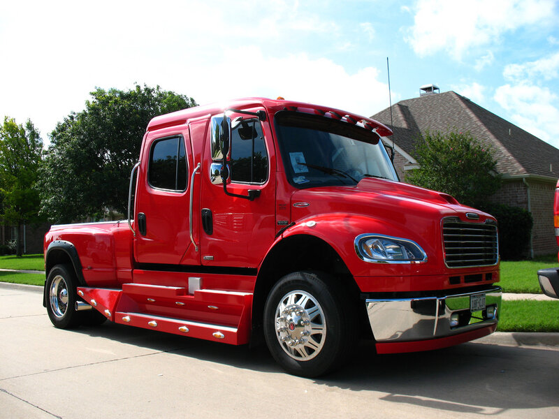 Red Freightliner truck on a street