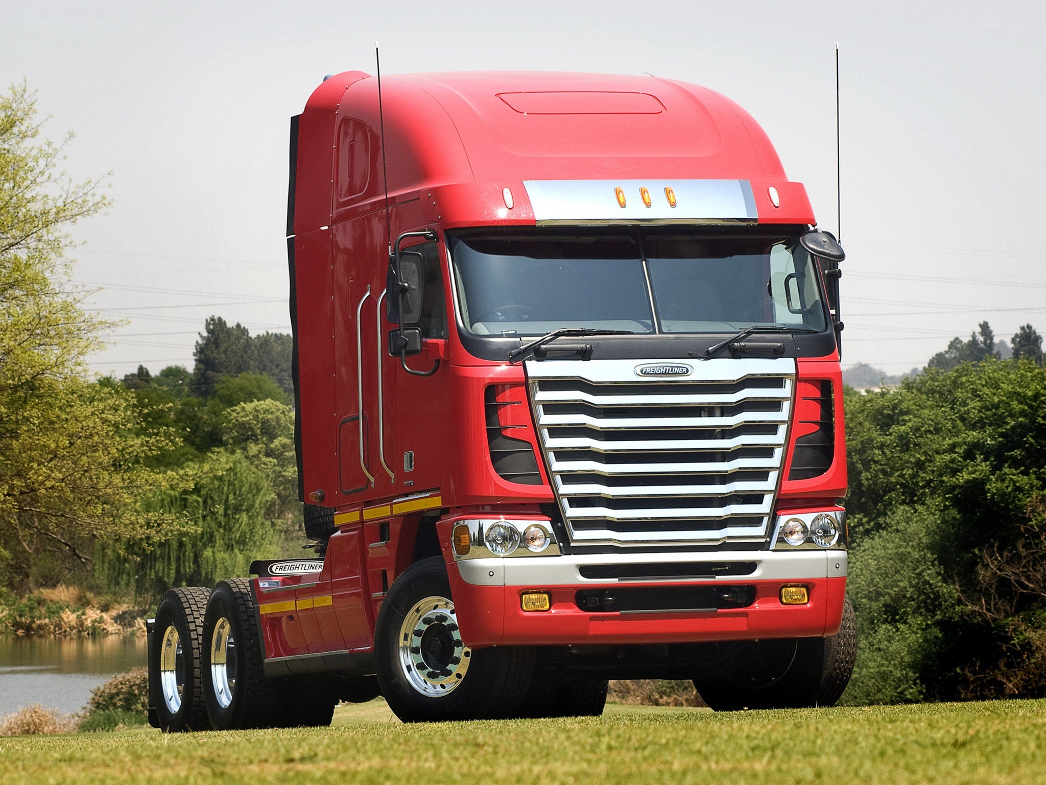 Red Freightliner truck on grass